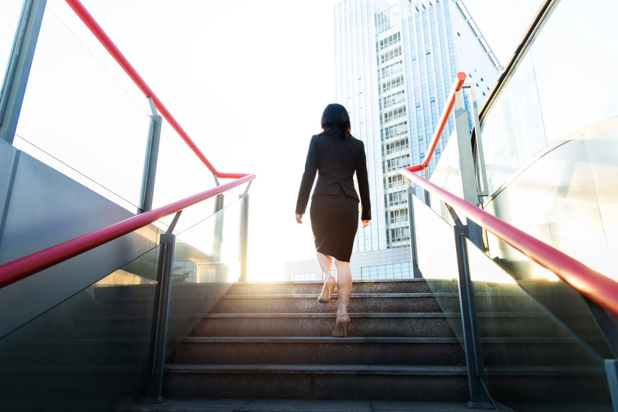 The businesswoman climbed up the stairs